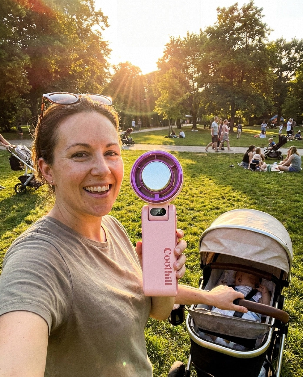 Mom using the CoolHill fan at the park