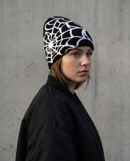 Woman wearing the Webline Knit Beanie in Black Web